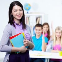 happy-teacher-with-students-background_1098-2917